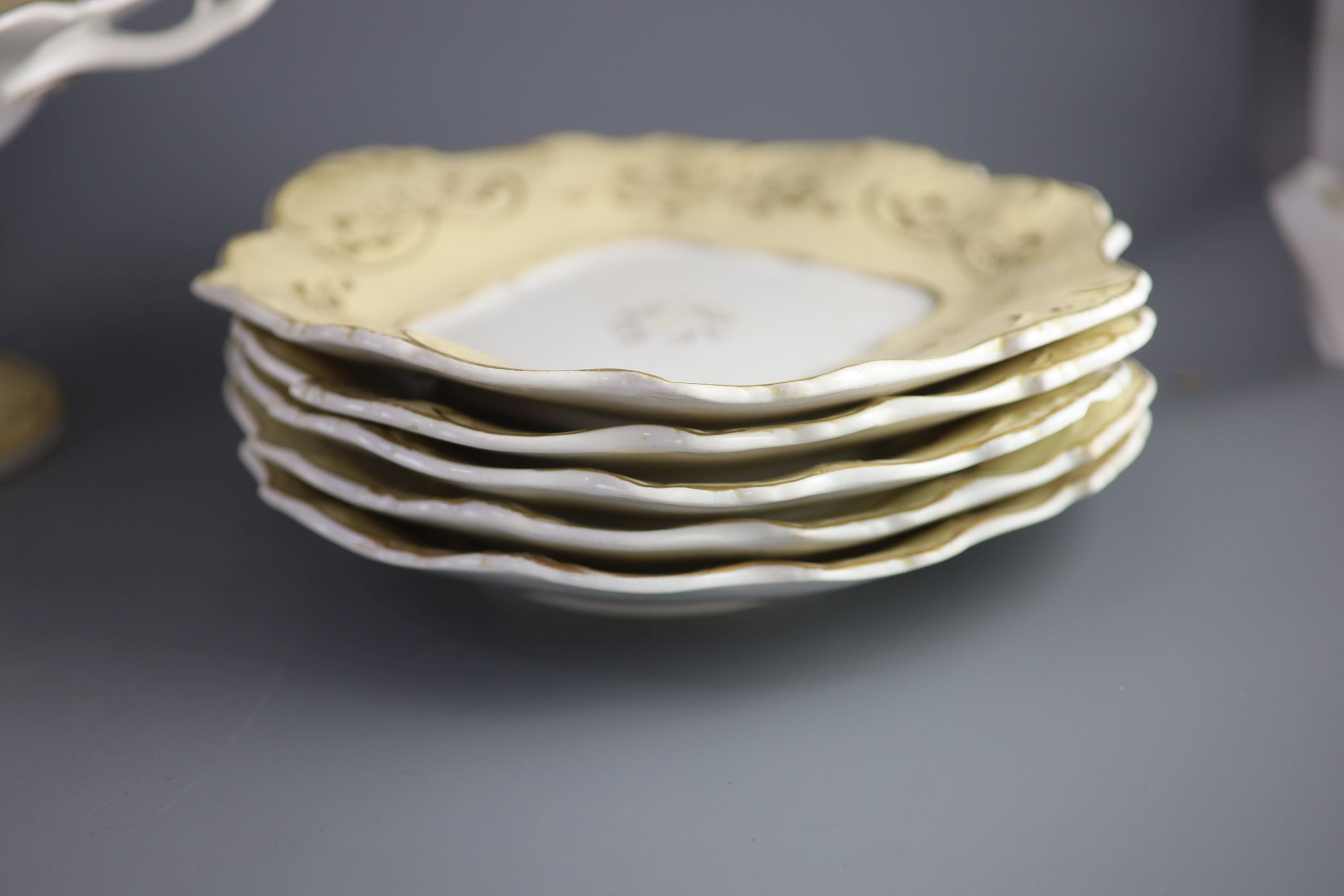 A Staffordshire cream and gilt twenty one piece part dessert service,